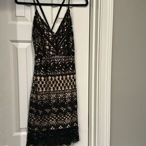Lulu’s small black with tan slip mini dress. New. Has tags